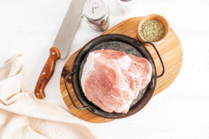 juicy tenderloin of farm pork to prepare a delicious lunch top view of the meat and ingredients for cooking white background photo